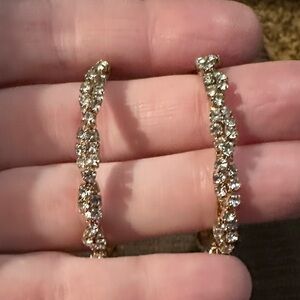 Twist Rhinestone Encrusted Hoop Earrings with Goldtone Hardware.